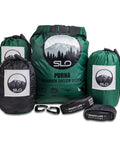 All In One Camping Hammock Kit With Bug Net And Rain Fly For Easy Setup Pro Grade Ripstop Nylon 12 Ft Tree Straps 5kN Carabiners Tent Stakes And Waterproof Carry Bag For Rugged Outdoor Comfort displayed with packs