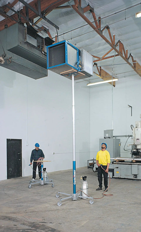 Portable Pneumatic Material Hoist For Bustling Job Sites delivers a 300 lb capacity and 12 foot lift in a construction setting.