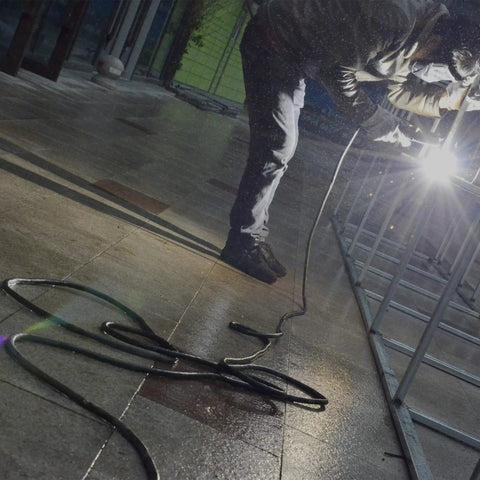 Heavy Duty 20 Foot Welder Extension Cord With 8 AWG Copper 250V NEMA 6 50 used for welding in a workshop.