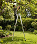 12.5 Foot Multi Purpose Folding Ladder For Home Roof RV And Painting, All In One 7 In 1 Aluminum Collapsible Extension Ladder With Large Joints, Adjustable Step Ladder, Lightweight And Rust Resistant, man pruning tree in garden