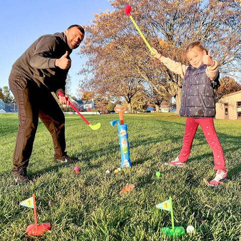 Toddler Golf Club Set With Pull Cart For Little Pros Ages One To Five Includes Super Lightweight Gear and soft balls used in a park setting.