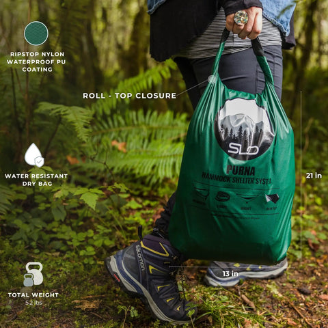 All In One Camping Hammock Kit With Bug Net And Rain Fly For Easy Setup Pro Grade Ripstop Nylon bag in forest setting