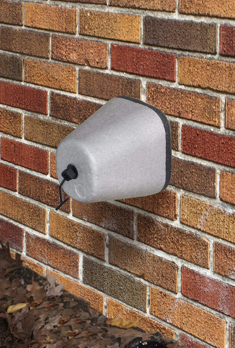 Outdoor Foam Faucet Covers Oval 4 Pack No Fuss Protect Your Faucets From Freezing Wind And Chill Easy To Install Eco Friendly And Energy Efficient Made In USA Gray on a brick wall