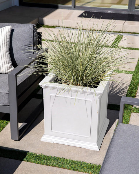 Cube Plastic Planter For Indoor And Outdoor Use, All Weather Durable Square Plant Pot With Drainage Holes, Great For Flowers Tall Plants And Trees, Modern Estate Style For Patio Or Front Porch displayed on a patio