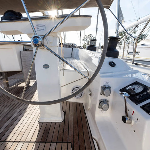 Boat cockpit featuring steering wheel and controls, showcasing use of Heavy Duty Waterproof Polyurethane Glue For Boats And RVs 20.3 Fl Oz Marine Adhesive Natural PU Bond For Above And Below The Waterline The Go To All Weather Repair Sealant For Wood Metal Ceramic Foam Glass.