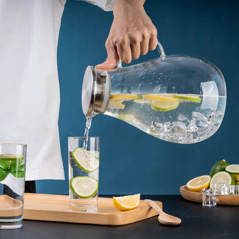 Premium Borosilicate Glass Pitcher With Lid 3000ml Hot And Cold Water Jug For Juices And Iced Tea Beverages Lead Free Eco Friendly Durable Carafe For Family Hangouts And Everyday Use pouring lemon water