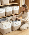 Woman organizing Heavy Duty Foldable Linen Storage Cubes 6 Pack Rock Solid Organizational Baskets with clothes in a closet.