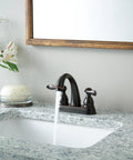 Centerset Chrome Bathroom Faucet For 4 Inch 3 Hole Vanity Sink With Metal Push Pop Drain Assembly And No Fuss Easy DIY Install Model B2596LF Built To Last, installed on a marble countertop next to flowers and soap.