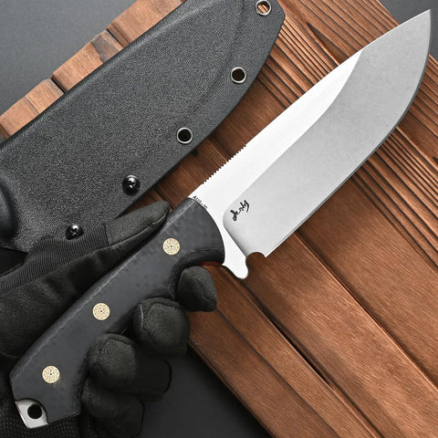 Rugged AUS 10 Fixed Blade Knife With Carbon Fiber Handle Full Tang Outdoor Survival Knife With Sheath, shown with sheath on wood surface.
