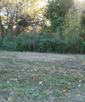 Children practicing archery with Travel Pro Portable Layered Foam Archery Target With Welded Core Technology in a field