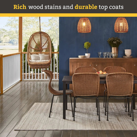 Outdoor patio with hanging chair and dining set on cedar-stained deck, showcasing rich wood stains and durable top coats.