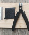 Nib Removal Tool Kit With Plier And Rubber Sheet for Fountain Pen Nib Slit Widening, shown on wooden surface.