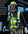 Worker wearing climbing style inspired safety helmet with six point suspension, vented for all day cool comfort, Scotchlite reflective trim, hi visibility green, ANSI X5014VX construction hard hat for worksites and tough jobs.