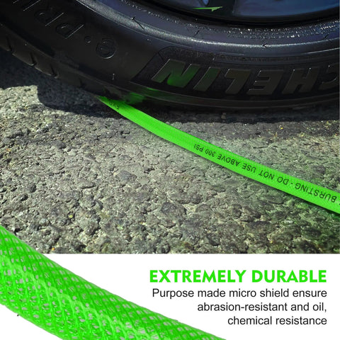 Built Like A Tank 1/4 Inch By 50 Feet Reinforced Polyurethane Air Compressor Hose With Quick Coupler Plug Kit Bend Restrictors 300 Psi Lightweight No Kink Design resting beside a tire on asphalt.