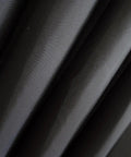 Close-up of Black Fabric Shower Curtain Liner Lightweight Washable Cloth For Bathroom With Bottom Weight And Water Repellent Finish No Fuss Easy Care No PVC 72 By 72 Inches showing fabric texture.