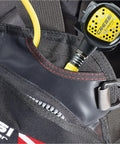 Close-up of Solid Jacket Style BCD For Scuba Diving Black Red 2XS with regulator pocket and durable stitching detail for dive centers.