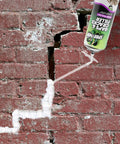 Top Shelf Gaps And Cracks Filler Foam Heavyweight Polyurethane Expanding Sealant For Insulating Doors And Windows Waterproof Paintable Straw Tip 12 Oz Two Pack applied to crack in a brick wall.