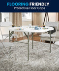 Grab And Go Ready 4 Foot Round Folding Plastic Table With Carrying Handle in living room setting with white chairs