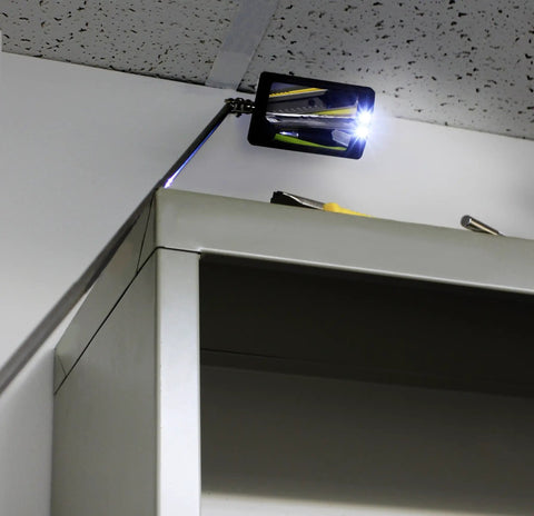 Telescoping Swiveling Inspection Mirror Tool with Twin White LED Lights inspecting above cabinet