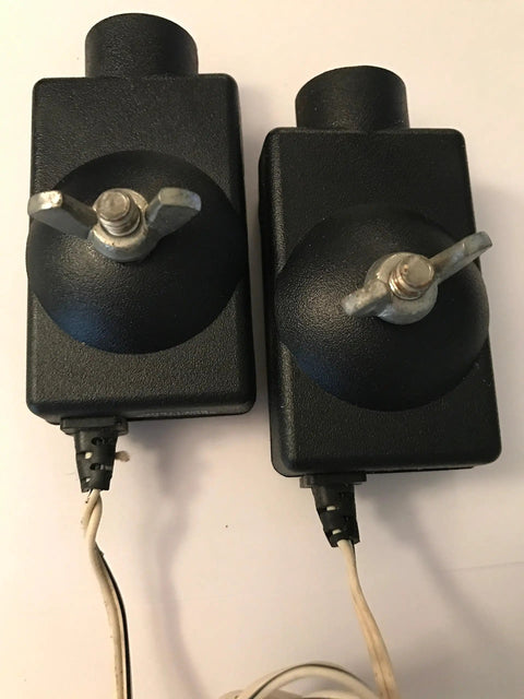 41A4373A Safety Sensors For Garage Door Openers showing two black units with metal bolts and cables, compatible with LiftMaster and Chamberlain