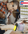 12 Pack Clear Storage Bins With Lids For Workshop Pantry And Garage Bulk Organizer next to man using a power tool