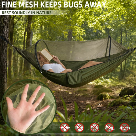 Person relaxing in green Go To Ultra Lightweight Travel Hammock With Pop Up Bug Net For Backpacking And Camping in forest.