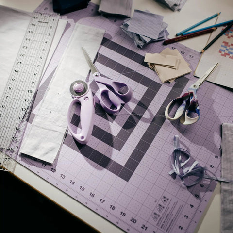 18 By 24 Inch Self Healing Cutting Mat For Sewing And Crafting, Dope Lilac Mountain Haze Color, Durable Grid Surface With Easy Read Measurements And 30 45 60 Degree Bias Lines For Precise Angle Cuts, Great For Quilting, Scrapbooking, Gift Wrapping, with scissors and fabric scraps