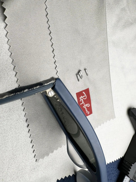 New Upgrade Heavy Duty Replacement Eyewear Hinge Screws And Precision Screwdriver For Wayfarer Shades on cleaning cloth.
