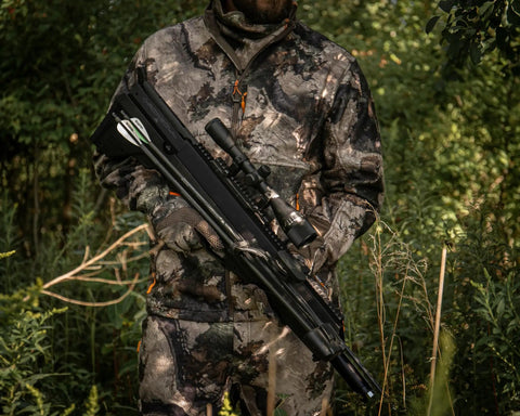Hunter holding crossbow with Pioneer Airbow Arrow Pack with 375 Grain Hand Fletched Helical Vanes, 26 Inch Pure Carbon Fiber, 250 Spine.