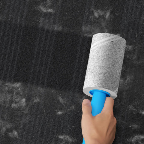 Using Extra Sticky Lint Roller Mega Value Set with 400 Sheets for pet hair removal on carpet, highlighting easy tear diagonal peel design.