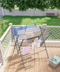 Heavy Duty Indoor Clothes Drying Rack With Twelve Solid Horizontal Rods And Tight Grip Sock Clips Efficiently air dries laundry outdoors on deck.