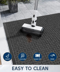 Close-up of All Weather Front Door Mat Indoor Outdoor 72 Inch By 36 Inch Non Slip Rubber Backing being cleaned on a patio.