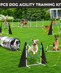 Dogs playing in Backyard Dog Agility Training Course Set For Pets, Easy Setup Obstacle Course With Grey And Black Tunnel, Hurdles.
