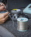 Person soldering with SAC Lead Free Solder Wire 0.5mm Diameter, 100g Roll, Sn96.5Ag3.0Cu0.5 Flux 3.5 Percent, using iron