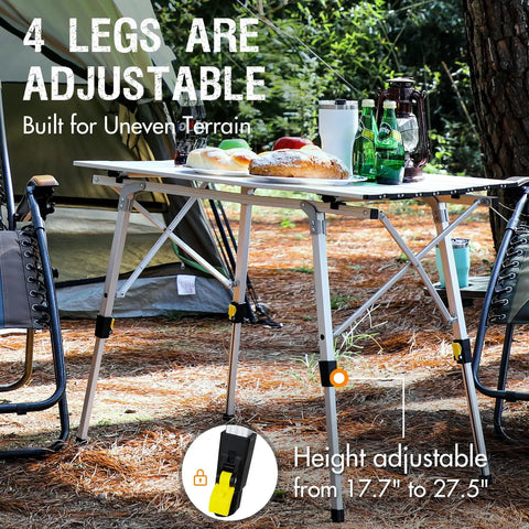 Foldable Outdoor Picnic Camping Table With Adjustable Height Aluminum Legs And Roll Up Top, set up at a campsite with chairs.