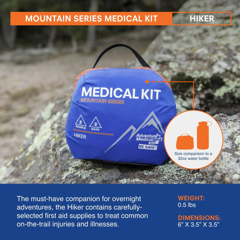 Mountain Series Trail-Ready Hiker First Aid Kit For Two People For Two Days on rock with size comparison to water bottle