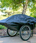 Covered Beefy Heavy Duty Utility Cart With 10 Cubic Feet Tub And 400 Pound Load Capacity With Flat Free Wheels in garden setting