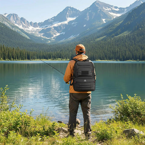 Man fishing by mountain lake wearing Fishing Backpack With Built In Cooler Water Resistant Tackle Bag With Rod Holders
