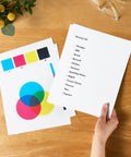 Real Deal Multipurpose Copy Printer Paper 8 Ream Case 4000 Sheets 20 Lb Letter Size 8.5 X 11 Inches on wooden desk with grocery list.