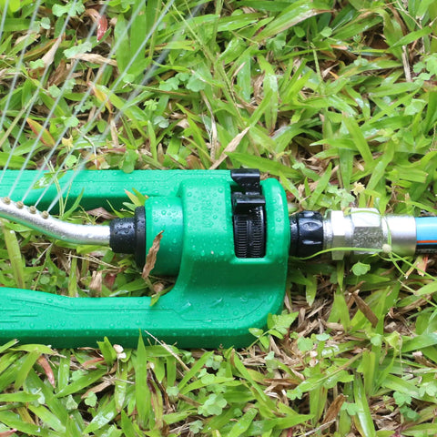 Green garden tool connected to hose with Heavy Duty 3/4 Inch Garden Hose Repair Kit With Stainless Steel Male And Female Ends