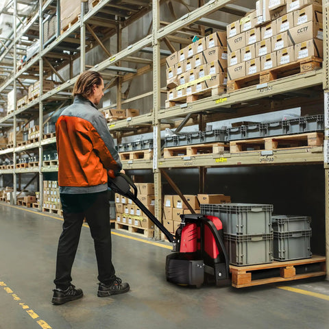 Powerhouse Full Electric Pallet Jack Bundle With Amps Boosting 4800 Lbs Capacity And 48 Inch Forks in warehouse operation.