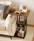 C-Shaped Side Table With Wheels And Large Wood Top next to sofa, holds remotes, game controller, sturdy metal frame.
