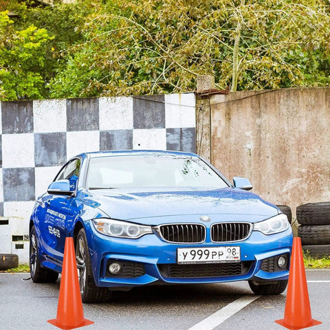 15 Inch Orange Traffic Safety Cones 7 Pack High Visibility Pro Grade Durable Plastic Parking And Training Cones next to blue car