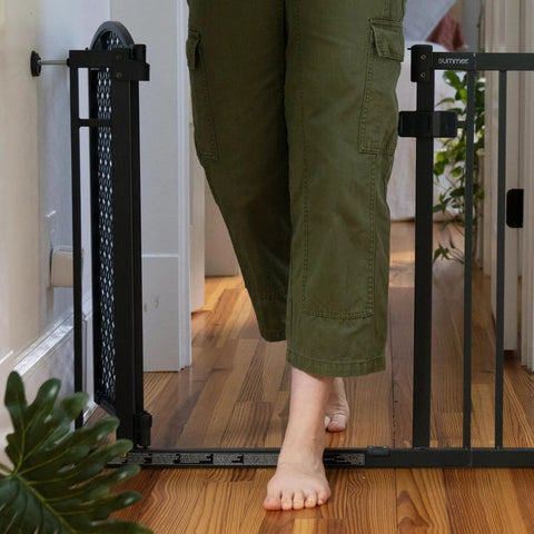 Walk Through Baby And Pet Gate Easy To Use For Doorways And Stairways No Drill Pressure Mount Adjustable, person walking through.