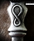 An ornate metal object with infinity symbol design, linked to Should I Do It Boss Life Decision Guide Real Talk For Everyday Choices.