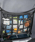 Ceiling Cargo Net With 3 Pockets And Double Layer Mesh Overhead Storage Organizer for cars and SUVs, filled with items.