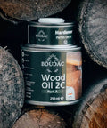 Top Shelf Two Component Hardwax Wood Oil For Indoor DIY Dead Simple One Coat Finisher VOC Free Linseed Mix Solid Black Tint For Furniture And Floors That Glides On Sleek In A 300 Ml Jar on stacked logs.