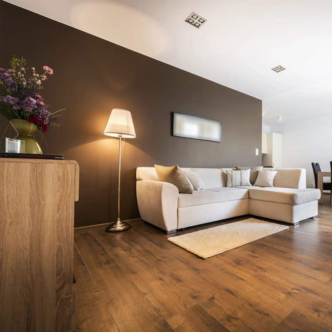 Modern living room with cozy lighting using 8W LED A19 Clear Filament Style Light Bulbs 3000K Soft White