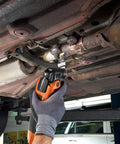 Rugged Starlock Oscillating Multitool Carbide Blade cutting through metal in tight vehicle space for demolition projects.