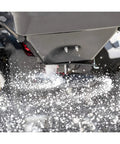 Beefy ATV Broadcast Spreader With Rain Cover, 100 Pound Capacity Poly Hopper spreading material in action
